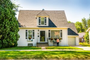 Well-maintained home exterior with lawn and mature trees